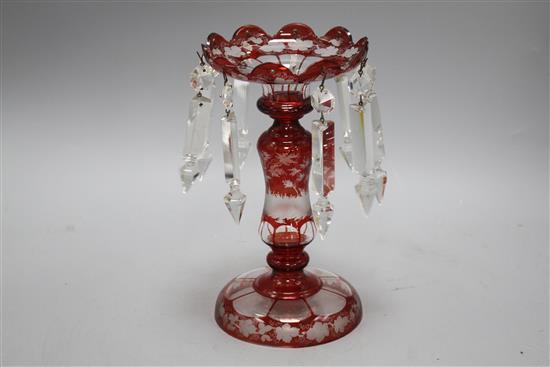 A late 19th century Bohemian ruby overlaid glass table lustre, with spear shaped drops and engraved with a stag, height 25cm